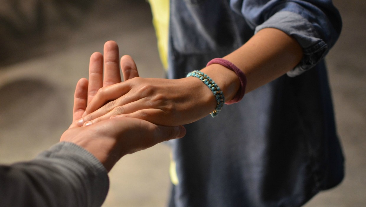 Two hands holding