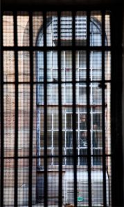 Photo of a barred window.