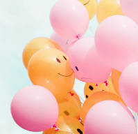 Yellow and pink balloons with smiles