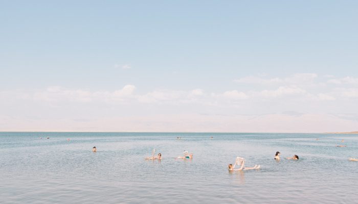 People Reading In The Dead Sea