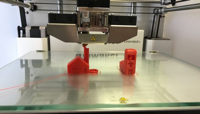 3D Printer Prints 2 Miniature Buildings