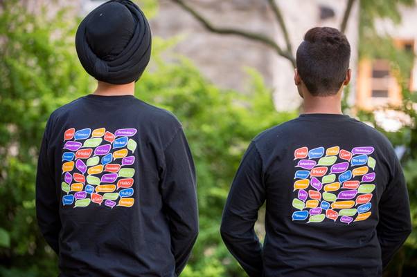 Photo Of Student Assistants’ Shirts: Hello In Several Languages