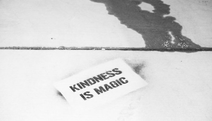 "Kindness Is Magic" Written On A Piece Of Paper And Left On A Sidewalk.
