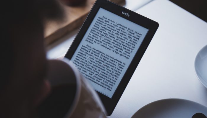 A Person Reading An Ebook.