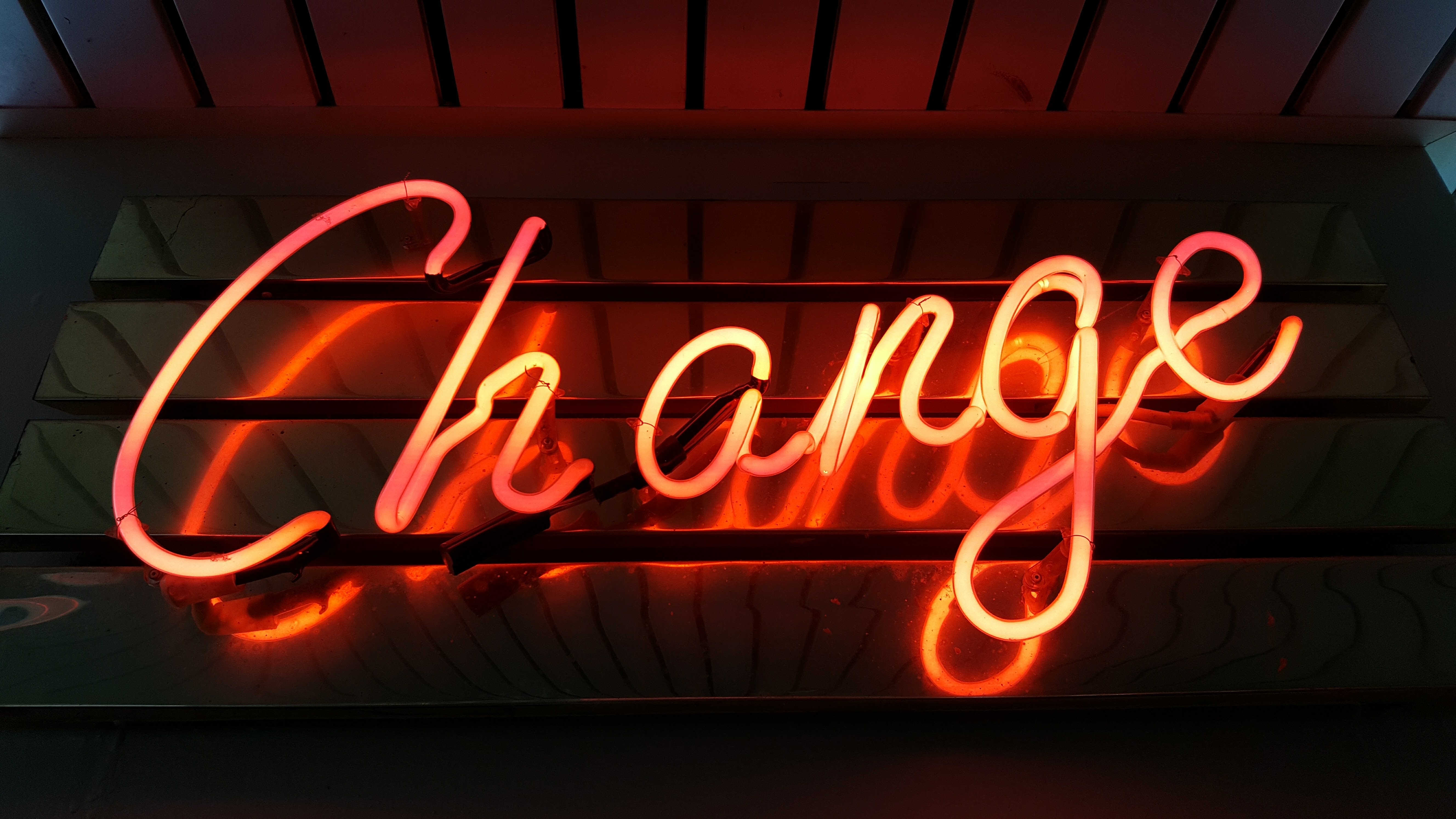 Neon light that spells the word, change.