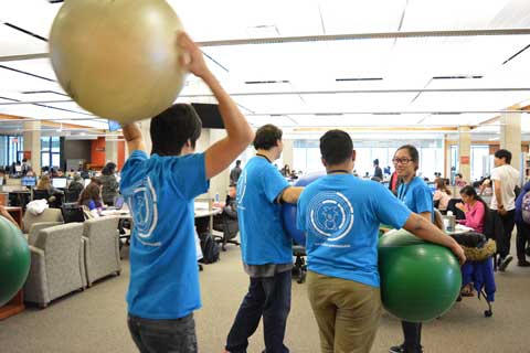 UTM Library Ambassadors running an event with exercise balls.