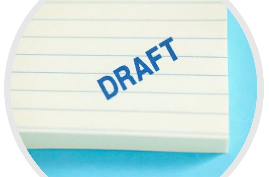lined pad of paper marked draft