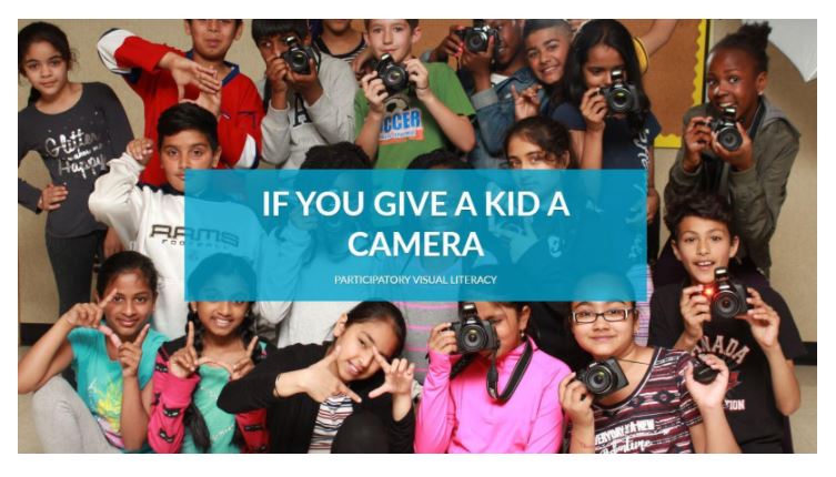 Large group of children with the caption Give a kid a camera